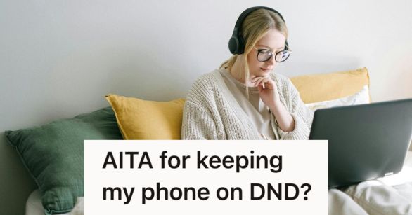 Woman typing at her computer in bed