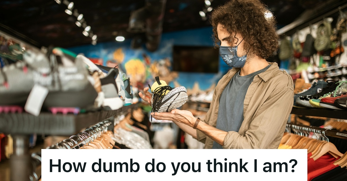 Man looking at a sneaker inside a store