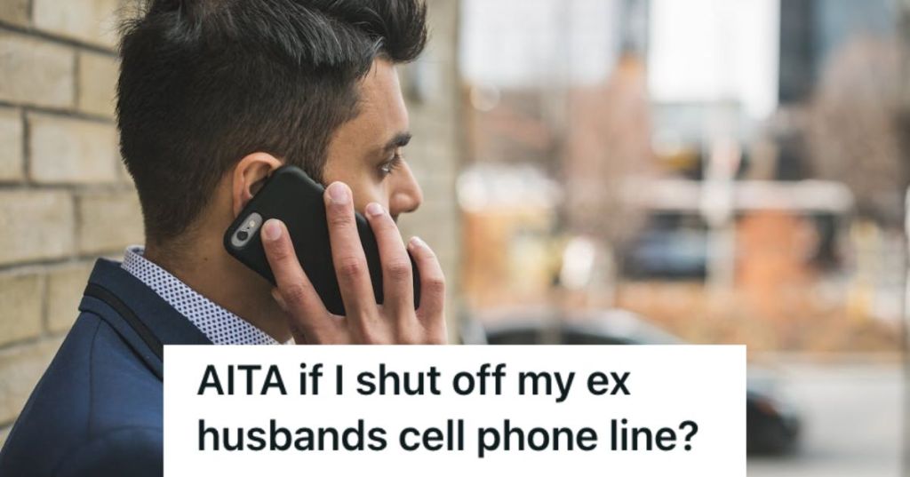 Man in business attire using his cellphone