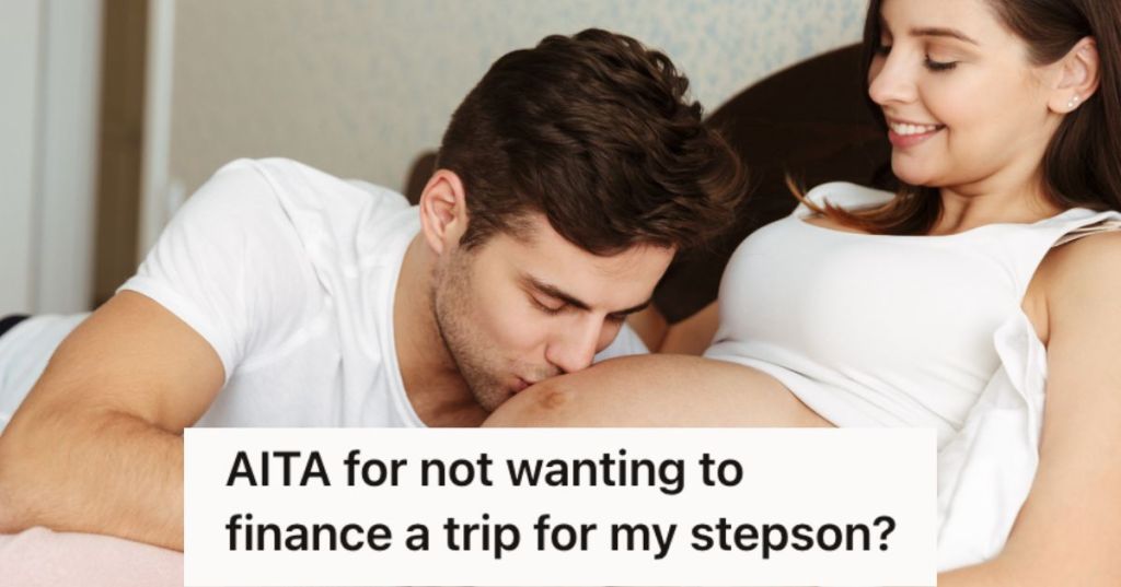 Man kissing the pregnant tummy of his wife