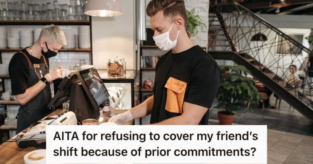 Two male staff working in a cafe