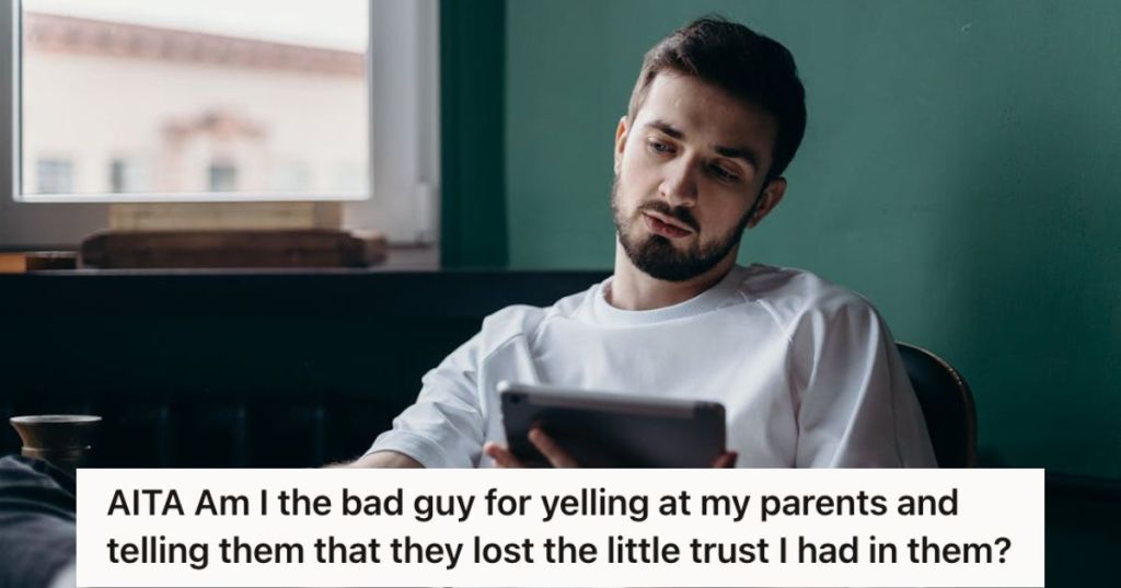 Young man holding a tablet and feeling disappointed