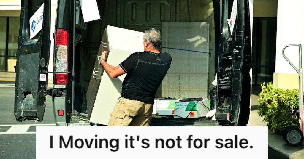Man putting furniture inside a moving truck