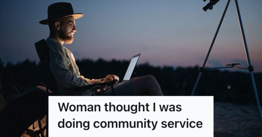 Man sitting on a camp chair with his laptop and tripod