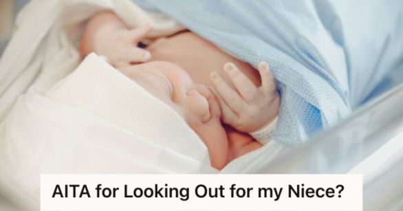 Newborn baby covered with cap and blanket in her hospital bed