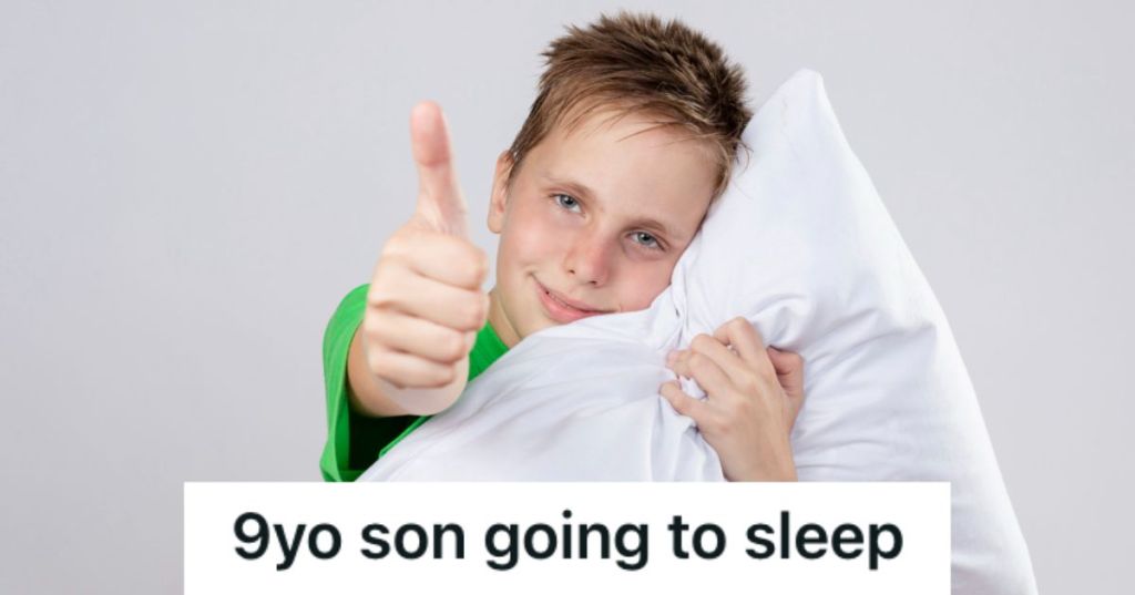 Boy hugging a pillow and doing athumbs up