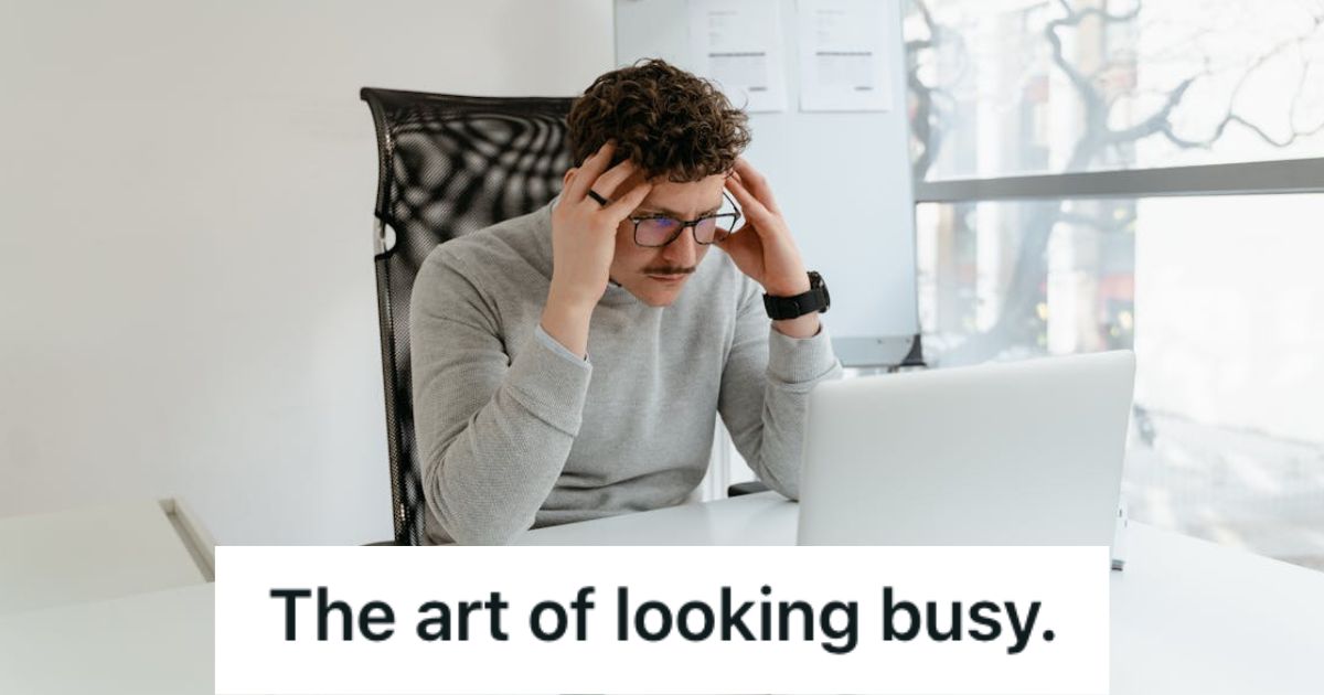 Man looking stressed while staring at his laptop