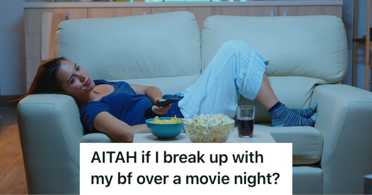 Woman lying on the couch bored while watching TV