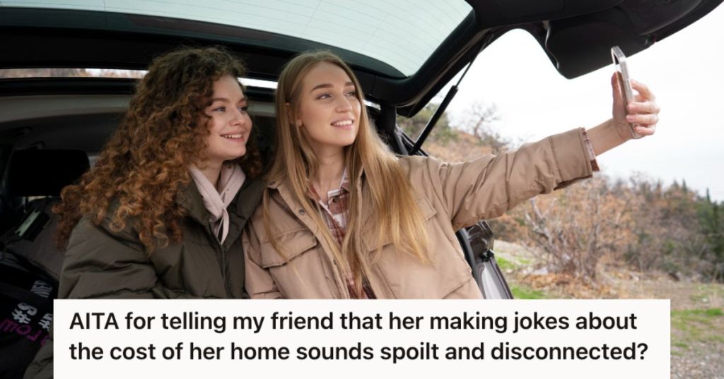 Two young woman at the back of their car taking a photo of themselves