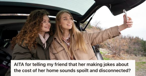 Two young woman at the back of their car taking a photo of themselves