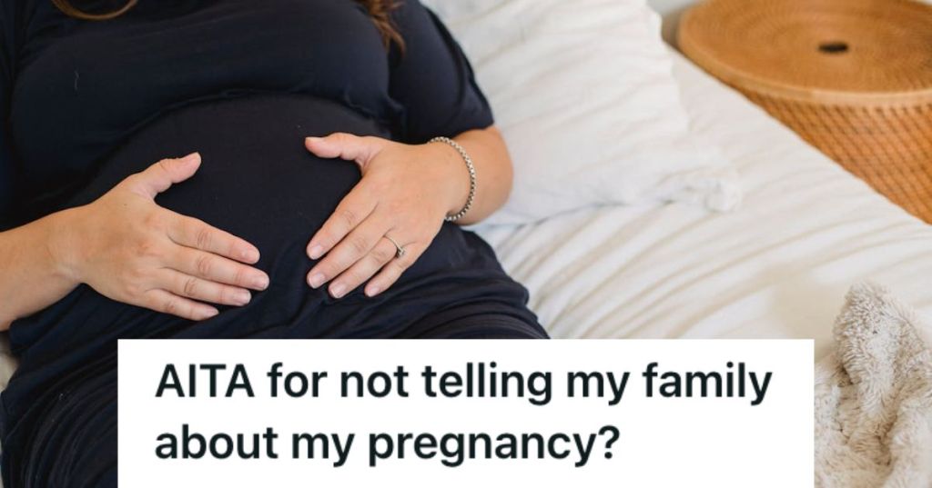 Pregnant woman lying on the bed and touching her baby bump