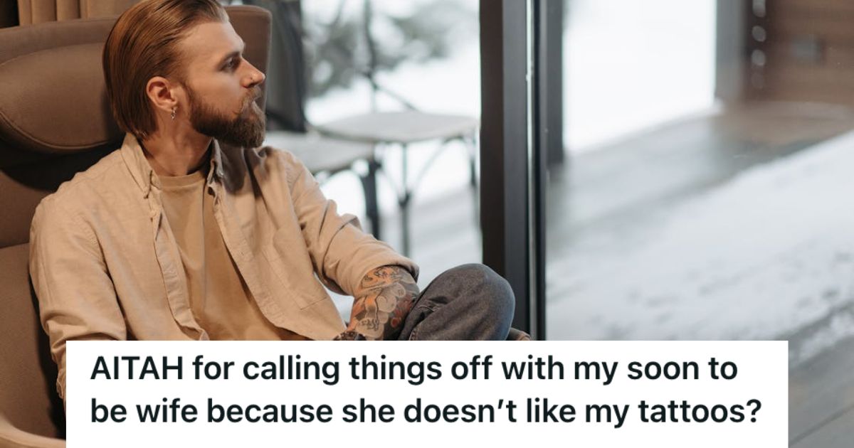 Man with tattoos sitting alone