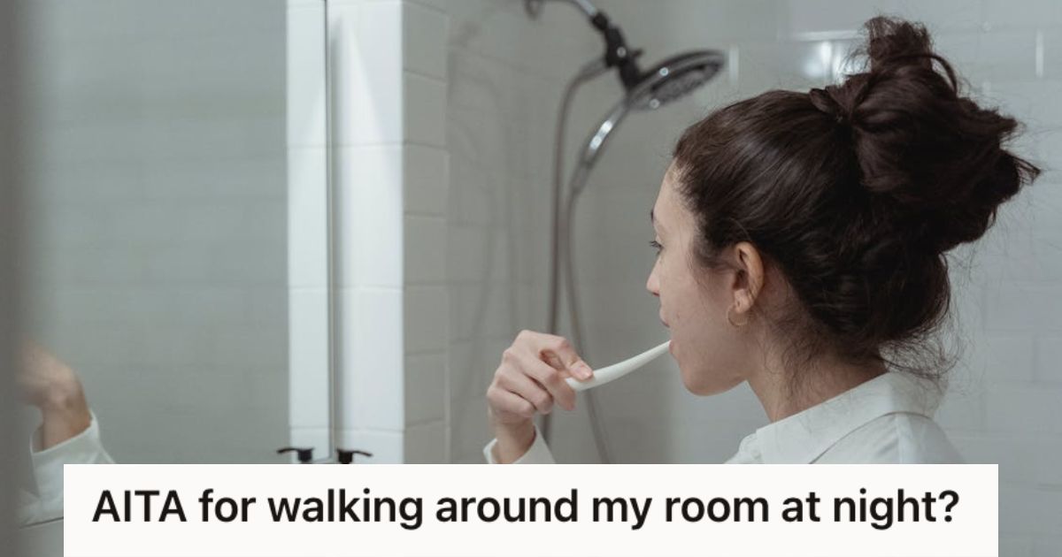 Woman brushing her teeth in front of a mirror