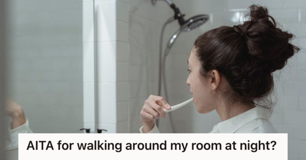 Woman brushing her teeth in front of a mirror