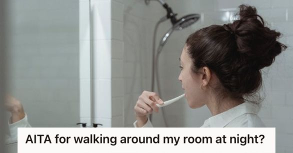 Woman brushing her teeth in front of a mirror