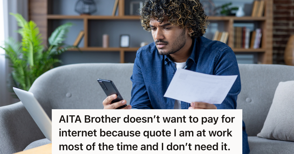 man looking at phone, computer and paper bill