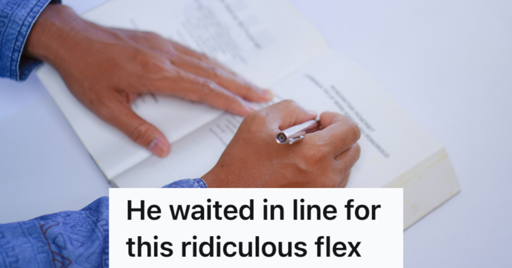 closeup of author's hands signing a book