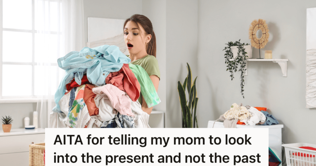 teenage girl holding a large pile of clothes