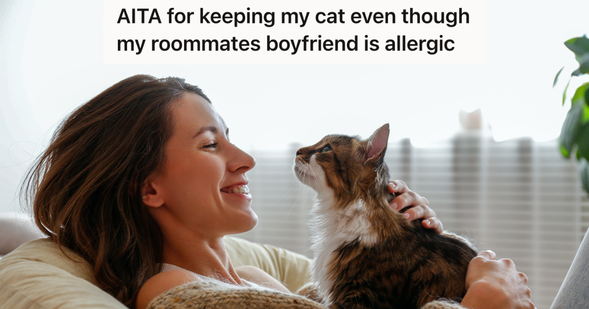 woman smiling at her cat