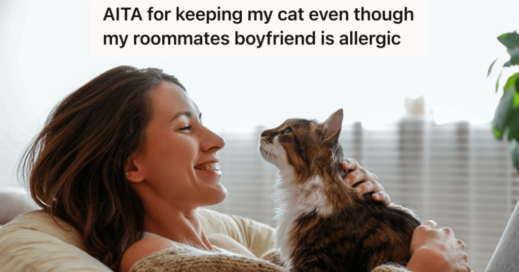 woman smiling at her cat