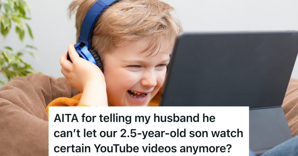 happy little boy wearing headphones and looking at a tablet