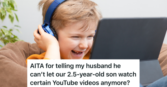 happy little boy wearing headphones and looking at a tablet