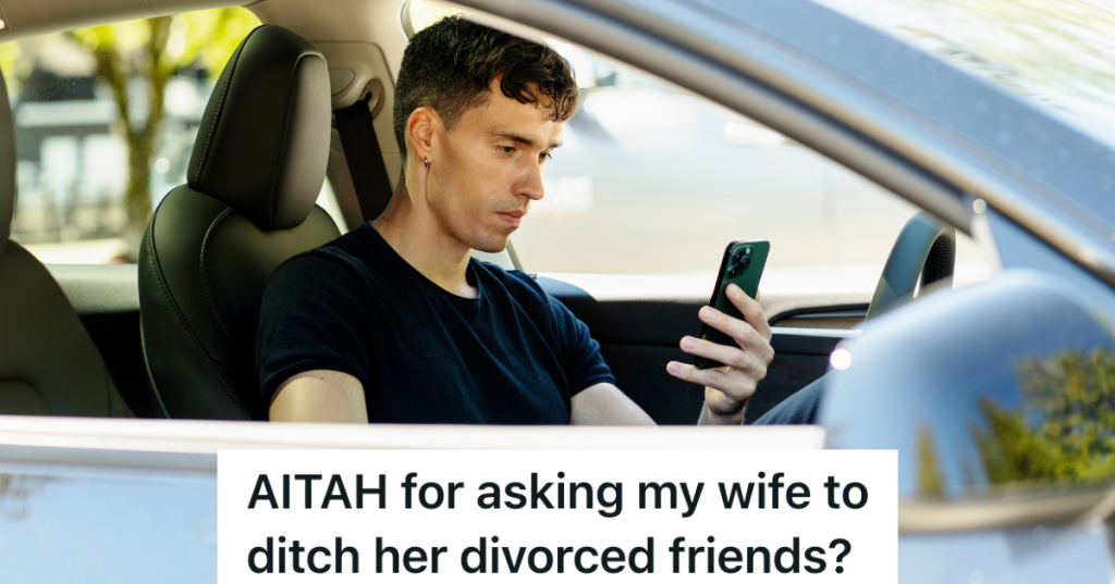 man looking at phone in car