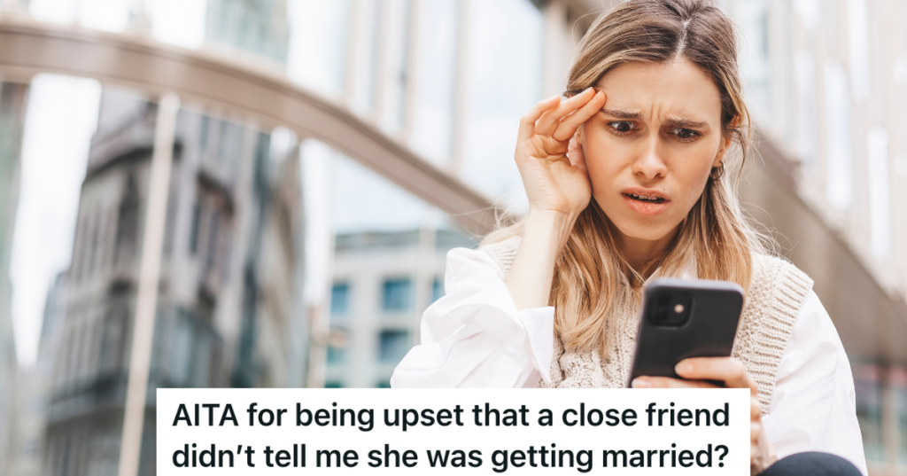 upset woman looking at her phone