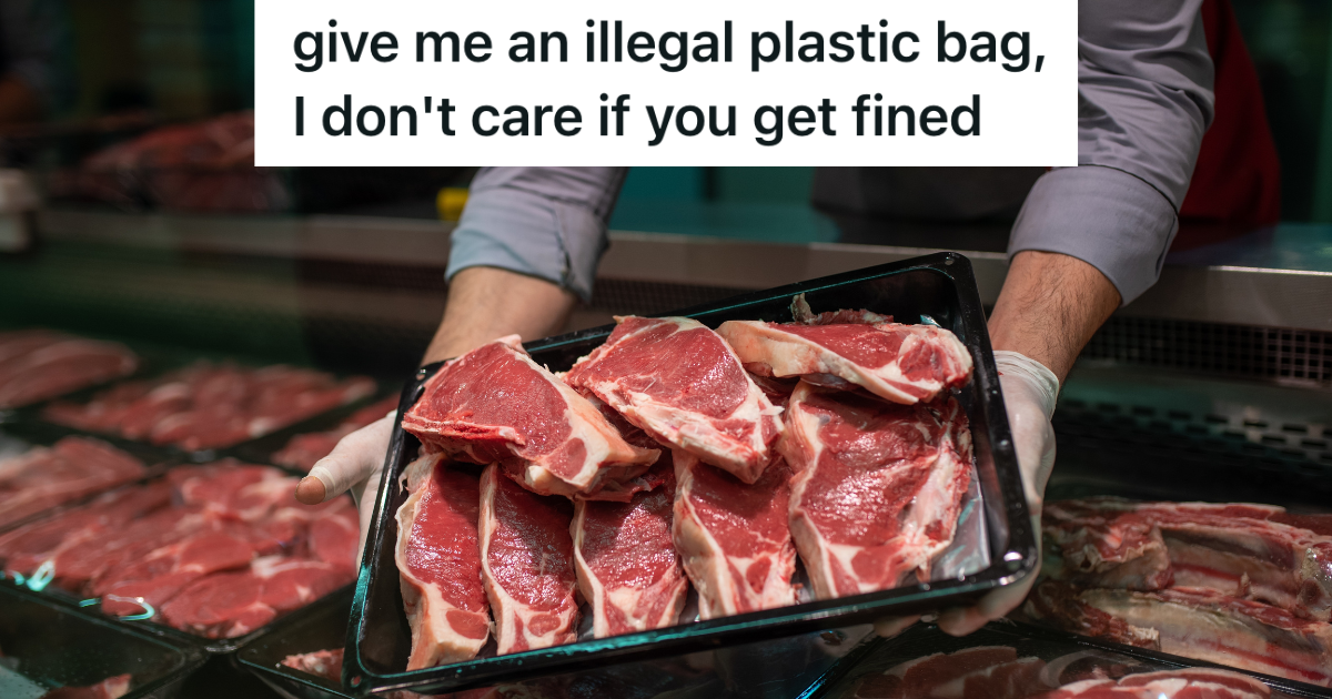 butcher's hands holding tray of meat