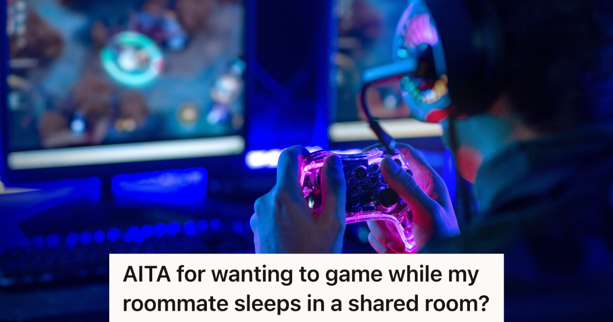 man playing video games at night