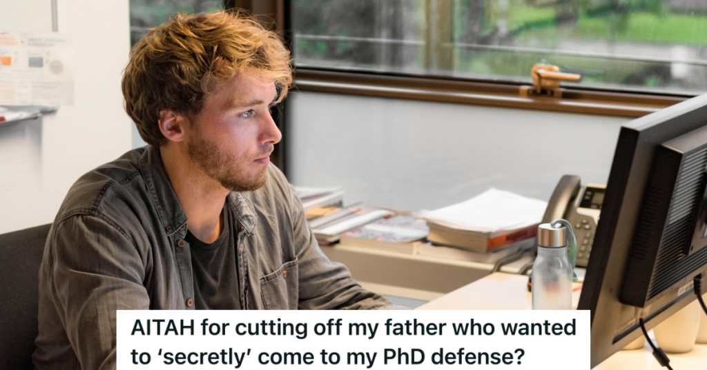 male Phd student working on his computer