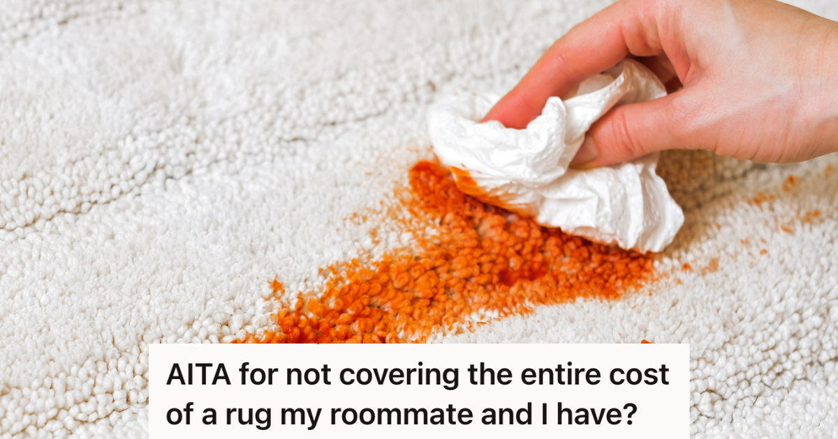 woman's hand cleaning red stain on white carpet