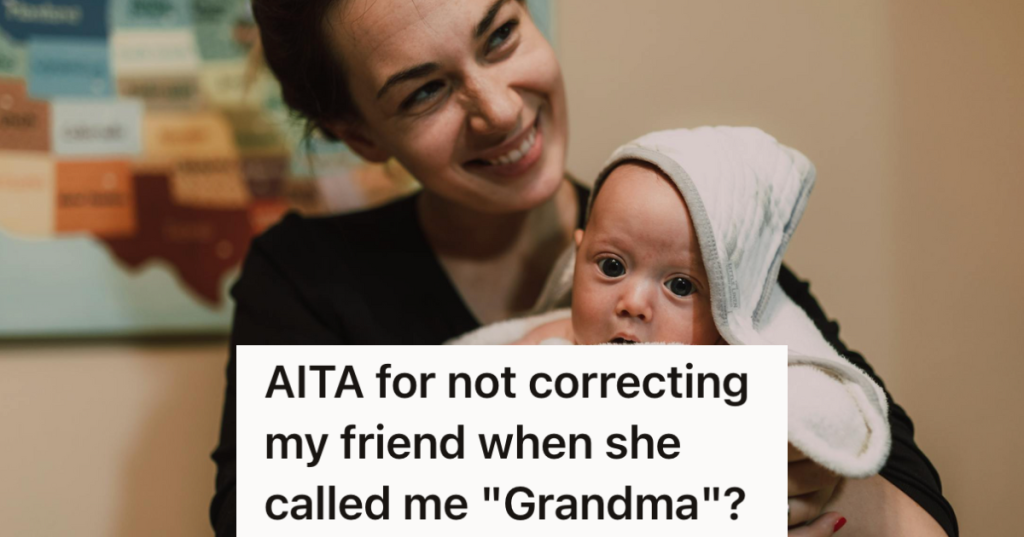 smiling young woman holding a baby