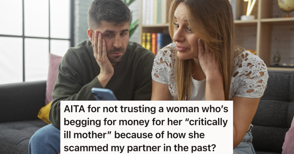 worried couple looking at a cell phone