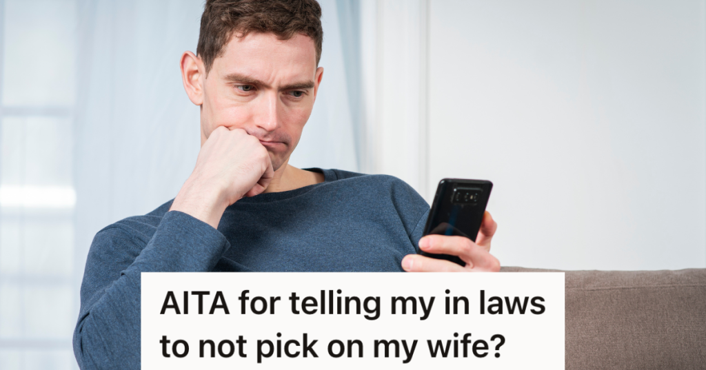 frustrated man looking at his cell phone