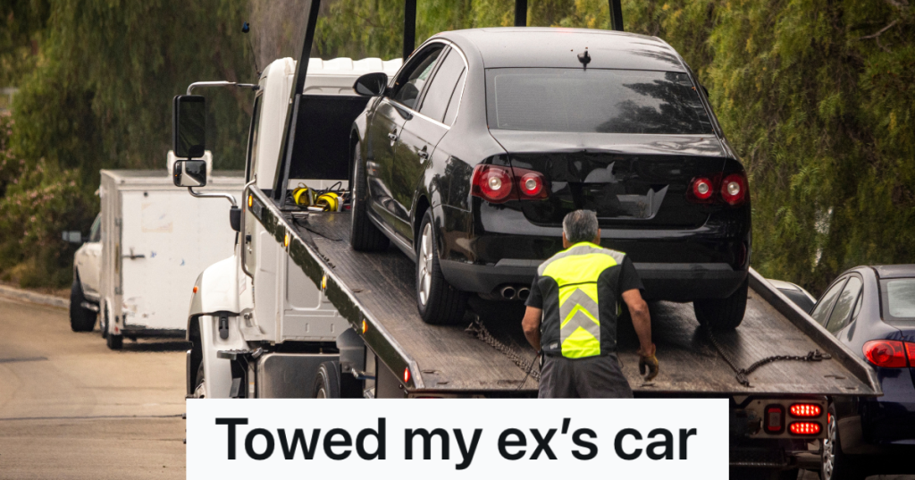 tow truck driver securing a car