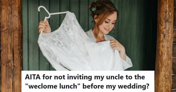 Woman holding up her wedding dress and smiling against a green wall