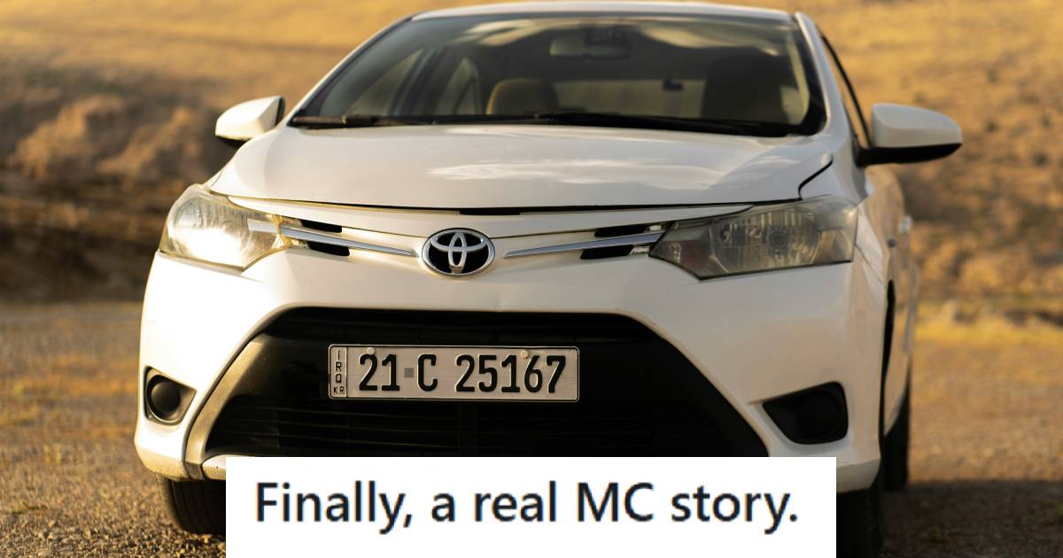 Small white Toyota Vitz sitting in the middle of the desert