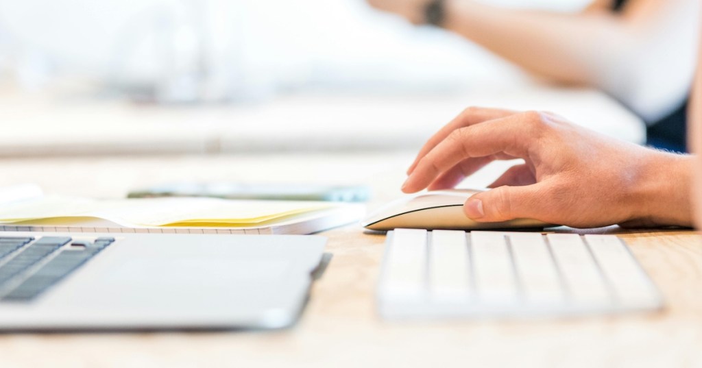 Hands on a keyboard and mouse