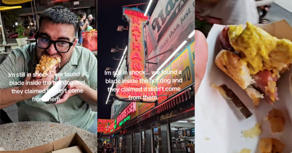 man eating a hot dog