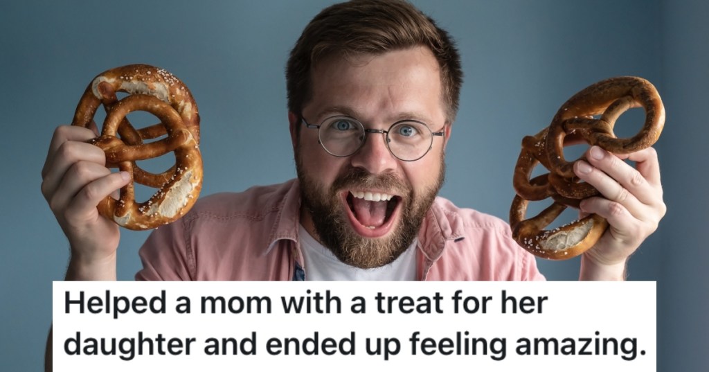 man holding two pretzels