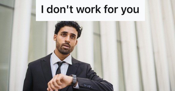 Man in suit looking at his watch
