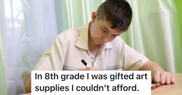 young boy drawing on paper