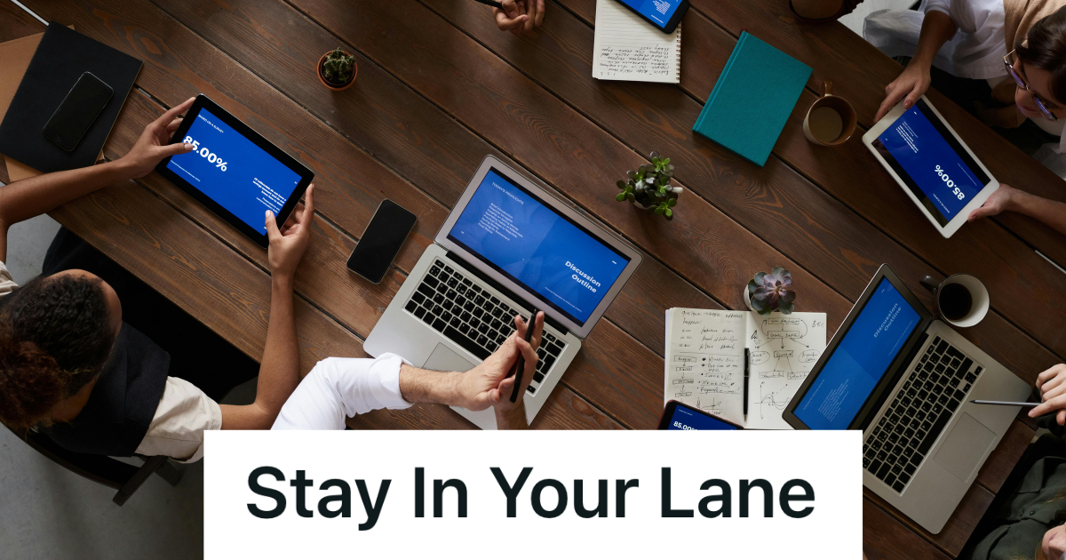 board meeting with employees at their computers