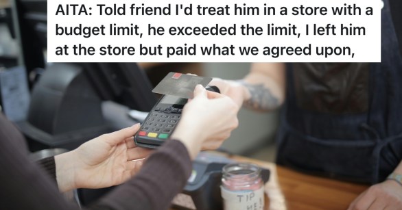 person paying for their items at a cashier with a credit card
