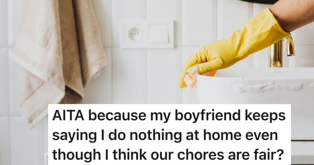 person scubbing the sink with gloves