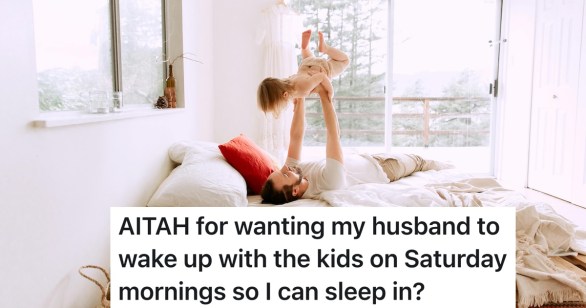 dad in bed with his daughter raising her up happily