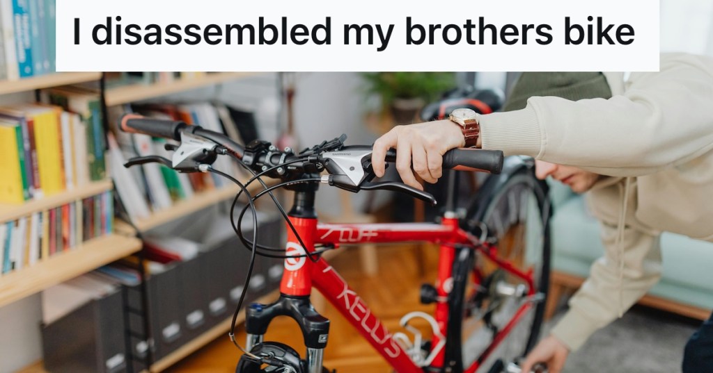 Man holding a red bike