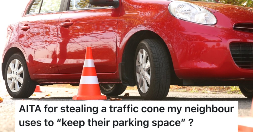 car next to a traffic cone