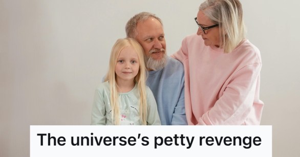 Older man looking at older woman while holding a little girl